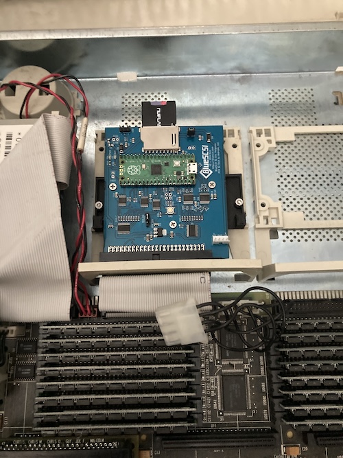 The BlueSCSI is inserted into the SparcStation, sitting in the little easy-remove tray.