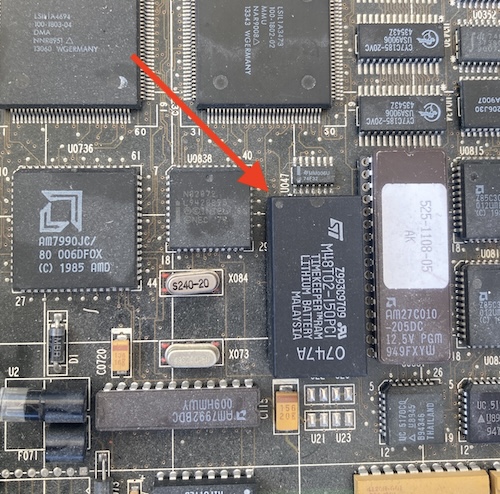 The Timekeeper IC in my SPARCstation's motherboard. A red arrow points to the dot indicating pin 1. The ethernet fuse is still missing from the previous entry.