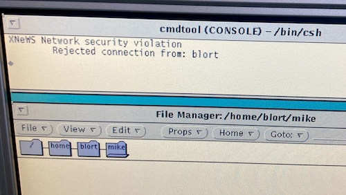 The console complains that there is an XNeWS network security violation and that it rejected a connection from blort, the same machine this is running on.