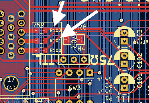 Two resistors, R102 and R101, are pointed to with white arrows.