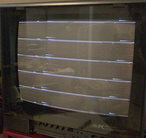 Some consistent lines and dots and garbage are present on the Mr.PC monitor showing the Tandy 1000SX's composite video output.