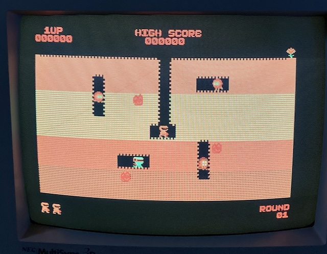 Dig Dug has turned a strange shade of orange, along with everything on the playfield.