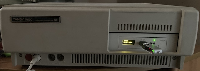 The Tandy 1000SX is closed up again, with the Gotek blazing away in the front.