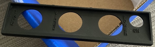 A replacement back panel, sitting on my kitchen tablecloth.