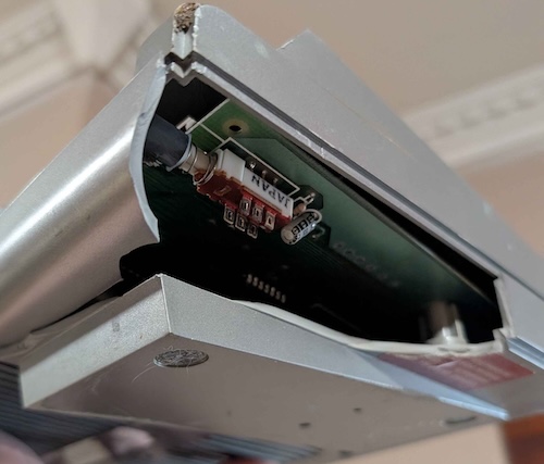 A whole corner is missing of the case, obscuring a switch.