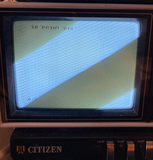 The Citizen portable TV shows a simple program: 10 PRINT 2+2, with no errors on the "1."