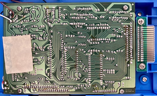 The "solder side" of the motherboard and cartridge slot.