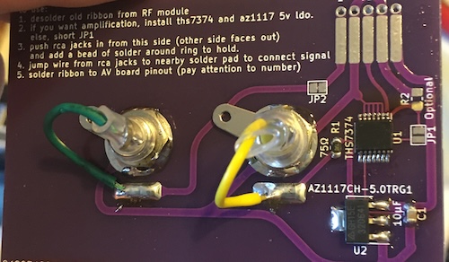 The PCB is assembled. Yellow and green wires run from the video and sound jacks to the PCB.
