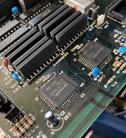 Solder bridges between two pins on these little 44-pin chips, IC93 and IC94.