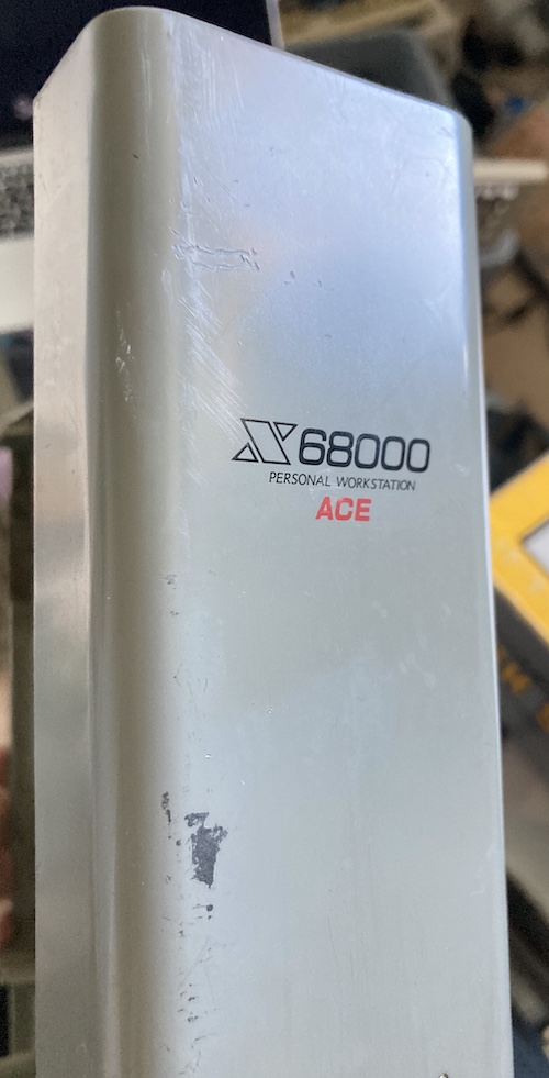 The front case plastics, reading X68000 ACE Personal Workstation. It has a lot of missing paint and dings.