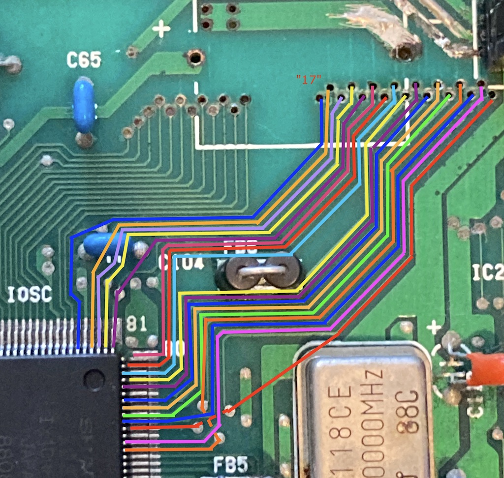 The IOSC trace out. Multicoloured lines flow from the vias to the pins of the IOSC.