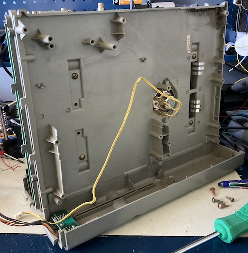 The internal speaker is hiding inside the plastics, attached with two short fine-thread screws.