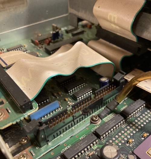 A 50-pin connector is in the foreground, near the ground cable for the card cage.