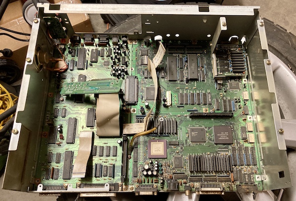 The motherboard is exposed, with no brackets or peripherals attached, except for the RAM card in the corner.