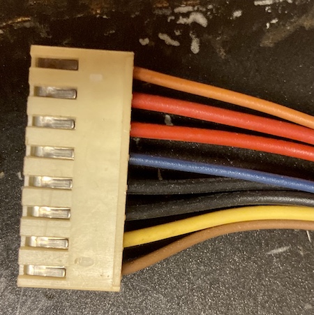 The power supply main harness connector.