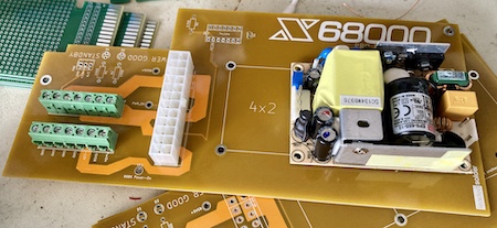 The second version of the X68000 PRO PSU board, now in an ugly mustard-gold colour. The Meanwell supply is resting on top of the board, and the 24-pin ATX connector and screw terminals are also test-fit.