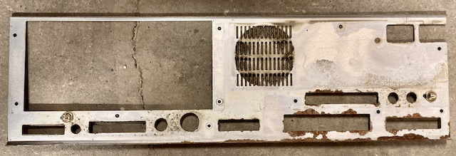 The rear panel metalwork, from the inside. You can see that rust has badly attacked the lower area near the RS-232 port.