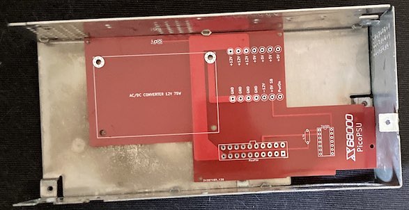 The X68000 ACE "tetris piece" power supply PCB does not line up with any holes on the PRO power supply case, and interferes with the fan location (lower-right.)